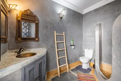 a bathroom with a sink and a toilet at Riad el hana en centre ville rooftop et bassin in Marrakech