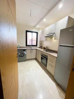 a kitchen with a refrigerator and a dishwasher at Luxury Aprt 2 bedrooms Pool Hivernage City Centre in Marrakech