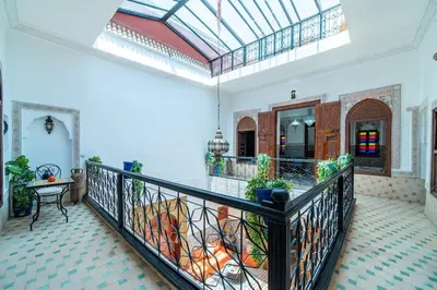a room with a balcony with a glass ceiling at Riad Khadoj-Marrakech-Traditional in Marrakech