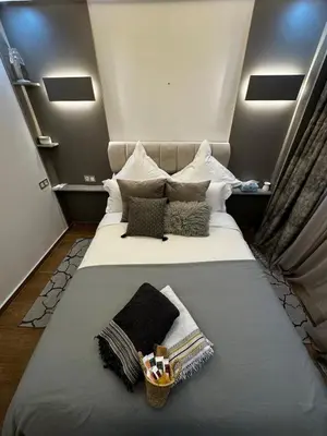 a large bed with pillows and a basket on it at Super duplex in the middle of Marrakech in Marrakech