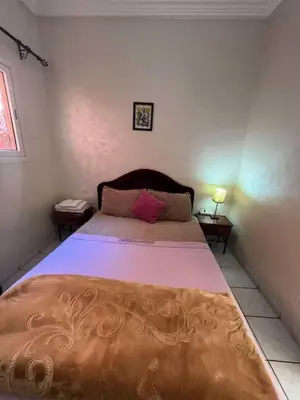 a bedroom with a large bed in a room at Riad 49 G26 in Marrakech