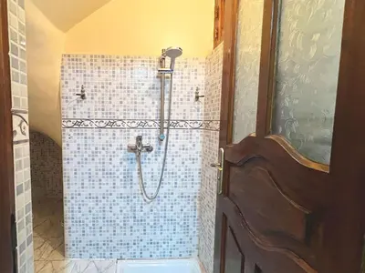 a bathroom with a shower with a toilet in it at Maison de Vacances Idéale à 10 min de l'Aéroport in Marrakech