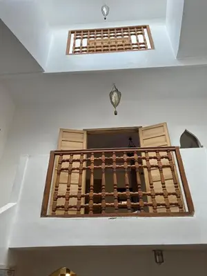 a staircase in a building with a window at LOGEMENT ENTIER MARRAKECh G4 N41 in Marrakech