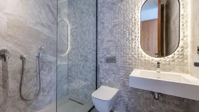 a bathroom with a toilet and a sink and a shower at Villa jardin atlas in Marrakech
