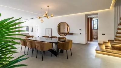 a dining room with a table and chairs at Villa jardin atlas in Marrakech