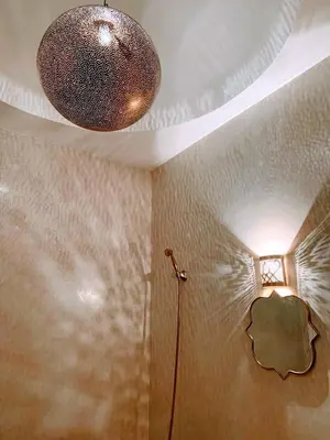 a bathroom with a ceiling with a light on it at Riad with 3 Swimming Pools in Marrakech
