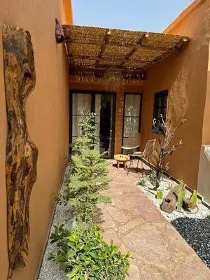 a courtyard of a house with plants on it at Cozy, Intimate Villa in Marrakech with Heated Swimming Pool Option in Touggana