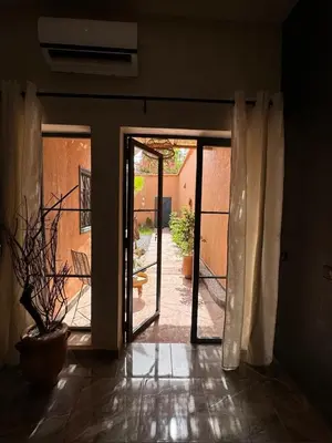 an open door to a patio in a house at Cozy, Intimate Villa in Marrakech with Heated Swimming Pool Option in Touggana
