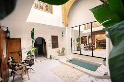 a living room with a tub in the middle at Riad Näjma Medina, privatisation, 8 personnes 2 Bassins in Marrakech