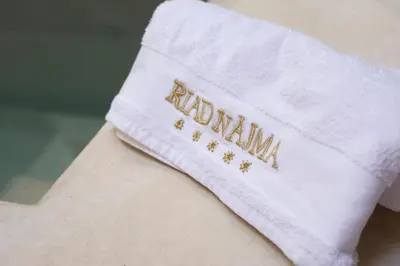 a white sock with the word autism written on it at Riad Näjma Medina, privatisation, 8 personnes 2 Bassins in Marrakech