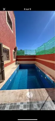 a swimming pool in the middle of a building at Villa Soufia in Marrakech