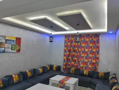 a living room with a couch and a curtain at Betterappart in Marrakech