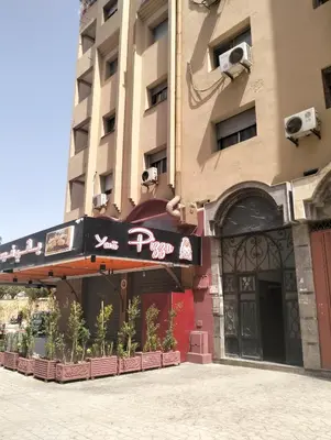 a building with a sign on the front of it at Betterappart in Marrakech