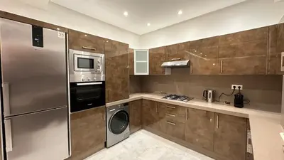 a kitchen with a stainless steel refrigerator and a dishwasher at NEW LUXURY APARTMENT - HEART Of MARRAKECH in Marrakech
