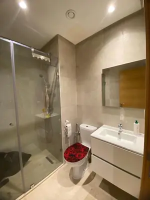 a bathroom with a shower and a toilet and a sink at Breathtaking views of golf in Marrakech