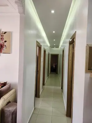 a hallway with many doors in a room at Comfortable apartment near the Airport in Marrakech