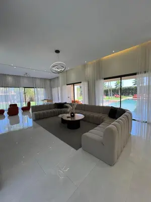 a large living room with a couch and a table at Les Villas de Marrakech in Marrakech