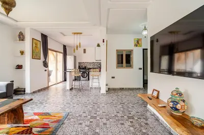 a living room with a couch and a table at Villa Slimani in Marrakech