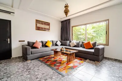 a living room with a couch and a table at Villa Slimani in Marrakech