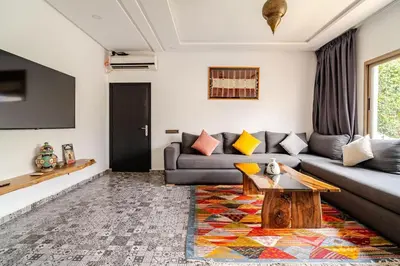 a living room with a couch and a table at Villa Slimani in Marrakech