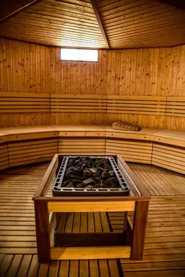a sauna with a stove in the middle of it at holiday villa in marrakech in Marrakech
