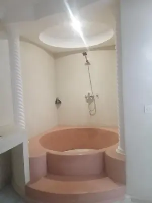 a bathroom with a large tub in a room at Run Villa Marine, Elegant Private Villa in Marrakech with Heated Pool Option in Marrakech
