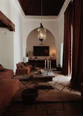 a living room with a couch and a table at Riad Berbère Marrakech in Marrakech