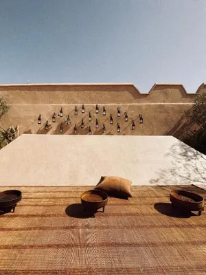 a building with four pillows on a roof at Riad Berbère Marrakech in Marrakech