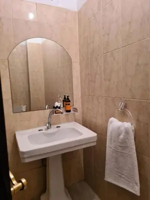 a bathroom with a sink and a mirror at Hotel Appart HB in Marrakech