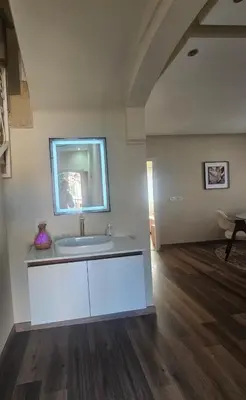 a bathroom with a sink and a mirror at very nice house in Marrakech