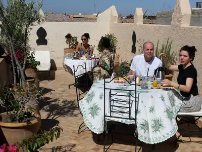 a group of people sitting at a table at superbe riad en exclusivité B&B in Marrakech
