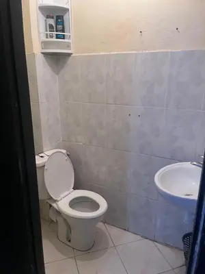 a bathroom with a toilet and a sink at Yassmirouaq in Marrakech