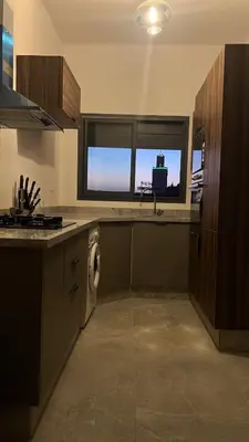 a kitchen with a washer and a sink and a window at Appartement tout neuf à Gueliz Marrakech Plaza Zara in Marrakech