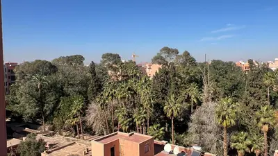 a house in the middle of a forest of trees at Appartement tout neuf à Gueliz Marrakech Plaza Zara in Marrakech