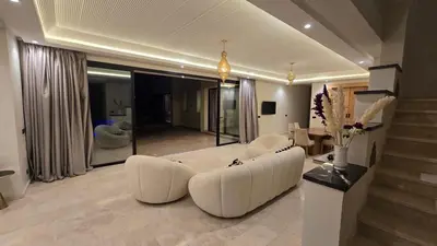 a large living room with a white couch and a living room at bianca in Marrakech