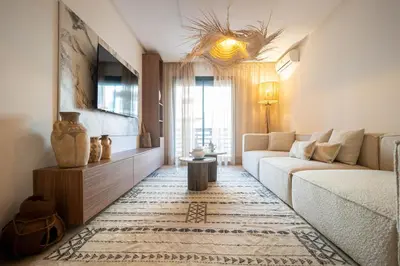 a living room with a couch and a table at Hivernage by Louhou Collection in Marrakech