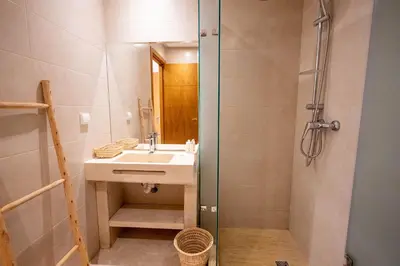 a bathroom with a sink and a shower at Hivernage by Louhou Collection in Marrakech