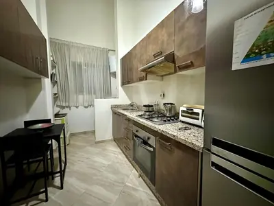 a kitchen with a stove and a counter top at Comfort and Charm in Marrakech 6 min from Gueliz in Marrakech