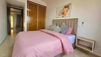 a bedroom with a pink bed with a pink blanket at Welcome to Chya House! in Marrakech