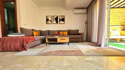 a living room with a couch and a table at Welcome to Chya House! in Marrakech