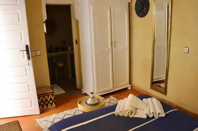 a room with two towels and a mirror on the floor at Riad Chez moi in Marrakech