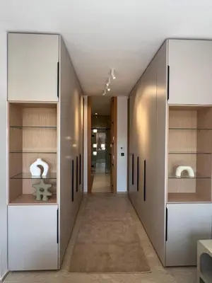 a hallway in a house with white cabinets at Dar Zohra in Marrakech