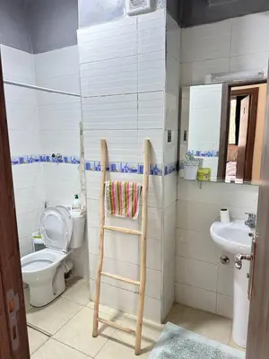 a bathroom with a toilet and a sink at Charming and Comfortable Room Near Marrakech Airport in Marrakech