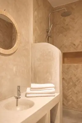a bathroom with a sink and a mirror at Riad Manah Marrakech - Ideal for groups & families in Marrakech