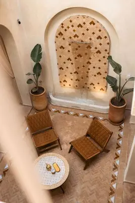 an overhead view of a room with two chairs and a table at Riad Manah Marrakech - Ideal for groups & families in Marrakech