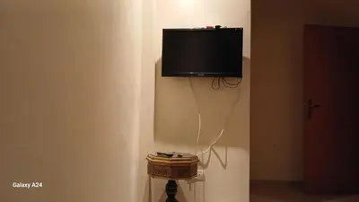 a flat screen tv on the corner of a wall at Horizon Sérénité in Marrakech