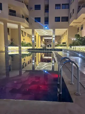 a swimming pool in the middle of a building at Apparently 2 bedrooms- baby equipment in Marrakech
