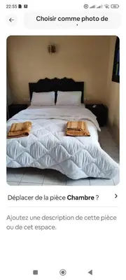 a bedroom with a bed with two towels on it at Riad Benhamou 3 in Marrakech