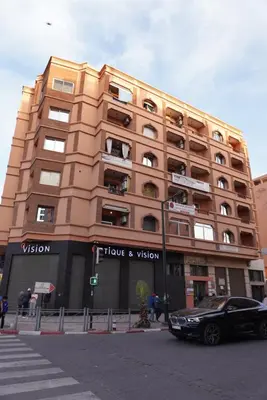 a building with a car parked in front of it at Maison Nadia in Marrakech