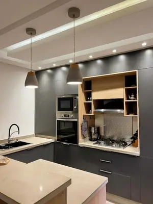 a large kitchen with gray cabinets and appliances at Bohemian Chic Duplex Marrakech in Marrakech